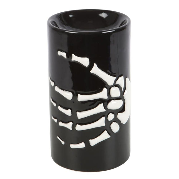 Black ceramic oil burner with skeleton design on a white background