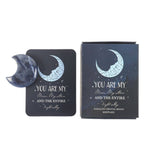 Sodalite crystal moon keepsake with packaging on a white background