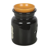 Black jar with an orange lid on a white background