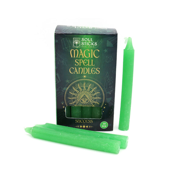 Green spell candles with packaging labeled 'Soul Sticks Magic Spell Candles Success' on a white background.