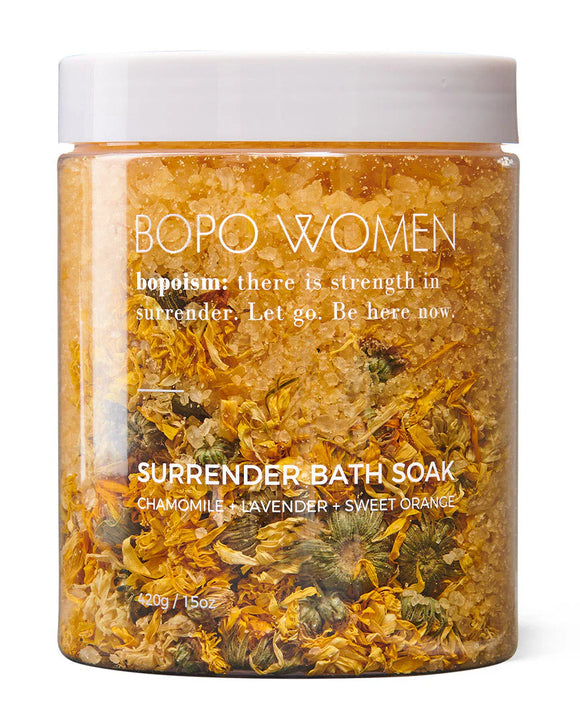 BOPO Women Surrender Bath Soak jar with dried herbs on a white background