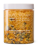 BOPO Women Surrender Bath Soak jar with dried herbs on a white background
