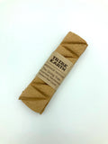 Tribe Earth incense stick wrapped in brown paper on a white background