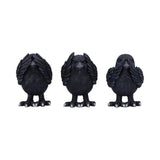 Three black bird figurines on a white background