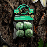 Packaged green balls with 'Ritual' label on a wooden background