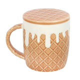 Mug with waffle-patterned lid and design on a white background