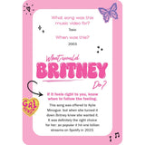 Pink card with text about a music video for the song 'Toxic' by Britney Spears, featuring a butterfly and heart graphics.