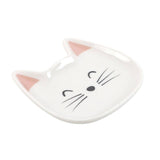 Cat-shaped white dish with pink inner ears on a white background