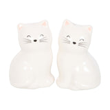 Two white cat-shaped night lights on a white background