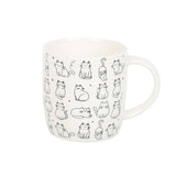 White mug with black cat illustrations on a white background