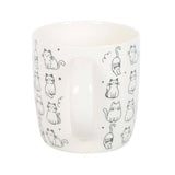 Ceramic mug with black cat illustrations on a white background
