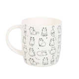 White mug with black cat illustrations on a white background