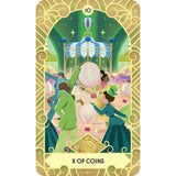 Card from a tarot deck featuring people with hot air balloons and ornate border.