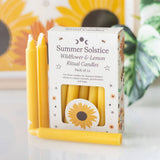 Pack of yellow candles with a 'Summer Solstice' box in the background