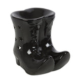 Black ceramic boot with star designs on a white background