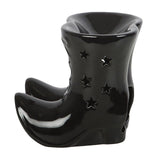 Black ceramic boot-shaped vase with star designs on a white background