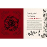Open book with red cover featuring a pentagram design and text on the right side.