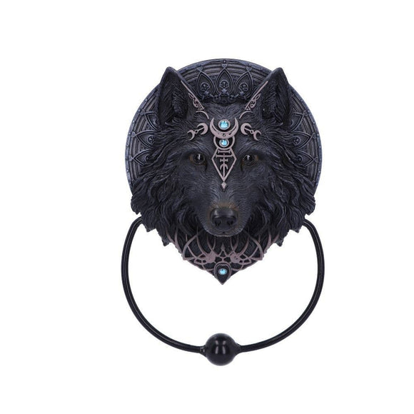 Decorative black wolf head with intricate designs and turquoise stones on a white background