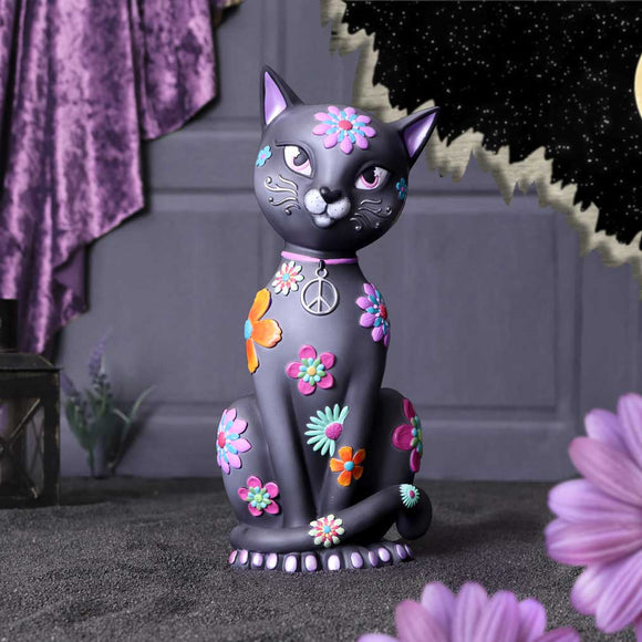 Decorative cat figurine with floral patterns on a dark background