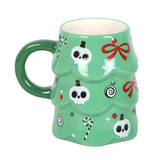 Green mug with Halloween-themed designs on a white background