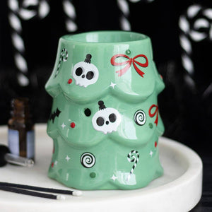 Green mug with decorative patterns on a white surface
