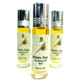 Three roll-on perfume oil bottles labeled 'White Sage Perfume Oil', indicating a capacity of 8ml, with the brand 'Kamini' visible on the labels.
